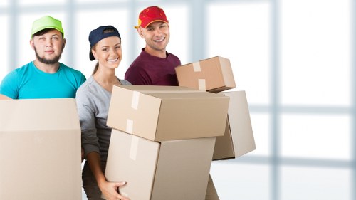 Removal team preparing a flat move in Ruislip with boxes and furniture